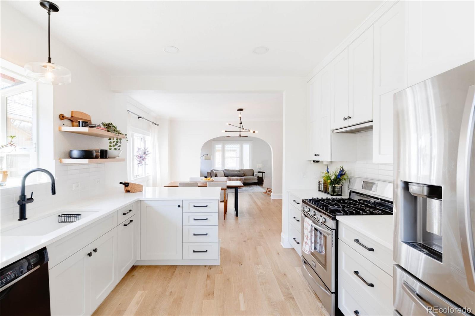 1058 Jackson Street Denver, CO 80206 - Photo 11 of 24 a kitchen with sink stove and cabinets