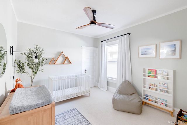a bedroom with furniture and a window