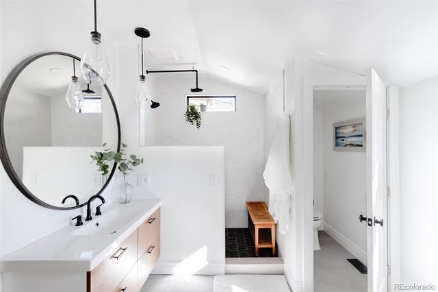 a bathroom with a bathtub and shower