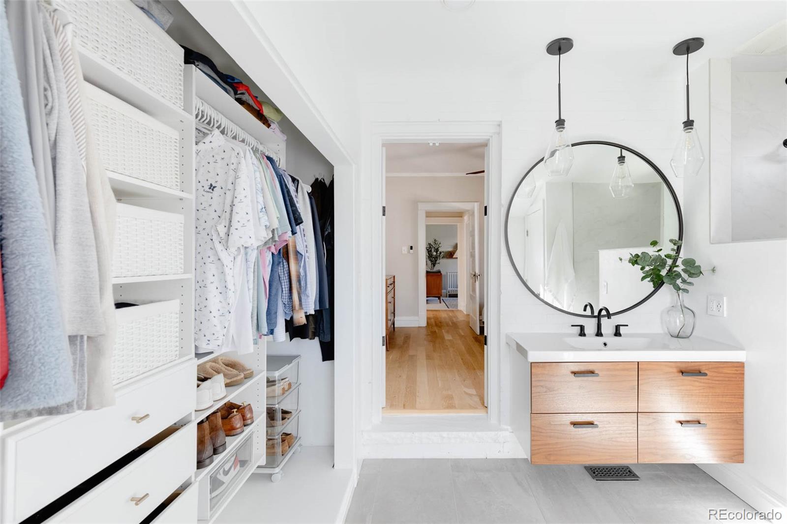 1058 Jackson Street Denver, CO 80206 - Photo 16 of 24 a bathroom with a sink and a mirror