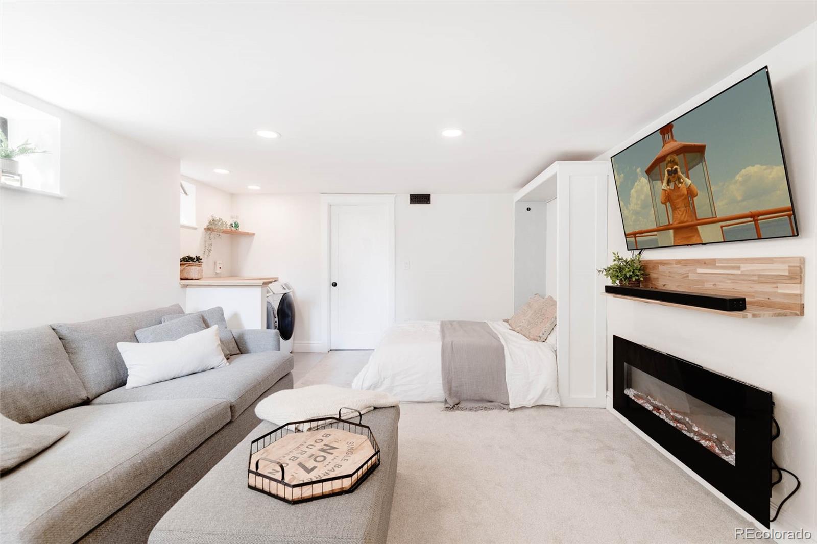 1058 Jackson Street Denver, CO 80206 - Photo 18 of 24 a living room with furniture and a fireplace