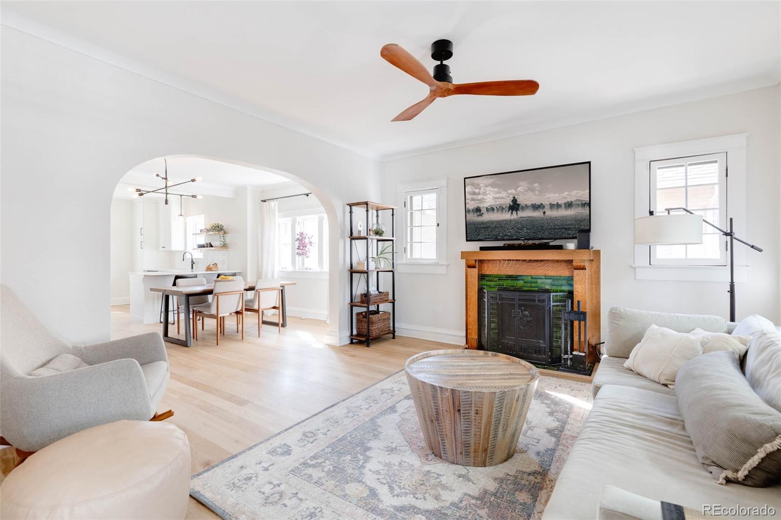 1058 Jackson Street Denver, CO 80206 - Photo 5 of 24 a living room with furniture and a fireplace