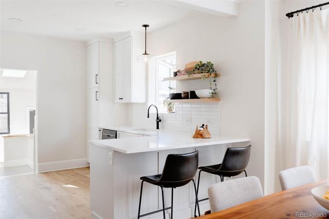 a workspace with a table and chairs