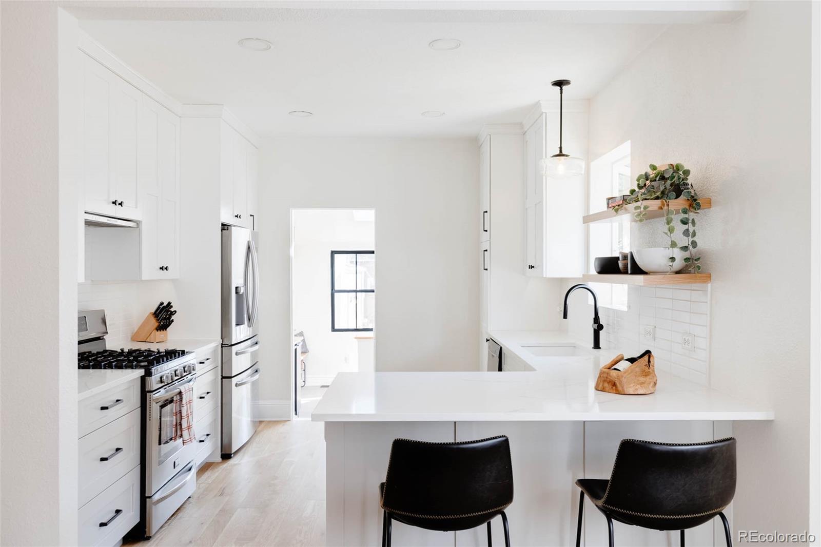 1058 Jackson Street Denver, CO 80206 - Photo 10 of 24 a living room with furniture and view of kitchen