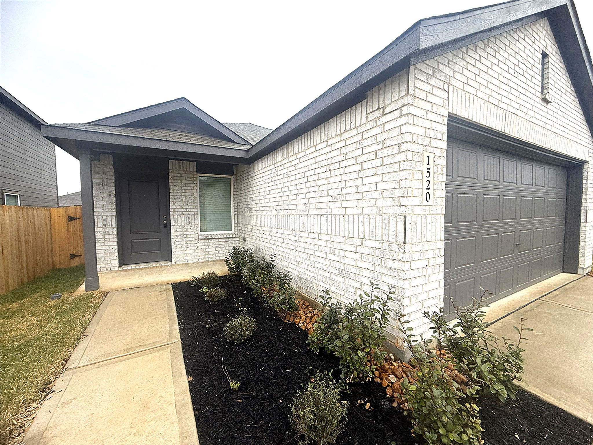 a view of house with backyard