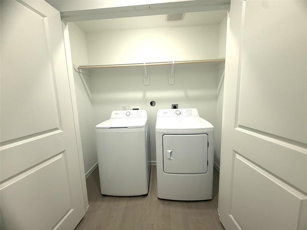 1520 Sunset Ridge Drive Conroe, TX 77306 - Photo 6 of 11 a utility room with dryer and washer