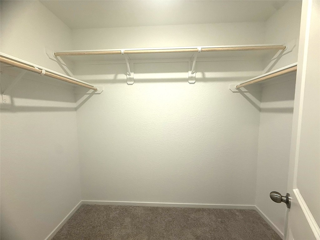 1520 Sunset Ridge Drive Conroe, TX 77306 - Photo 7 of 11 a view of a room with racks on the wall