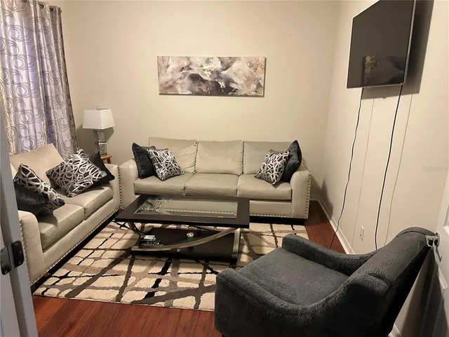a living room with furniture and a couch