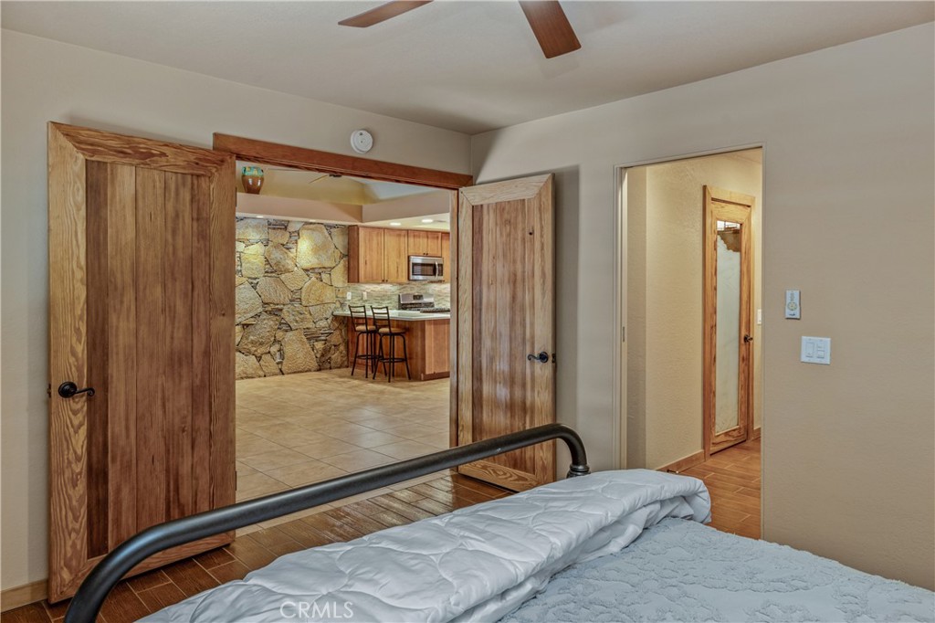 42002 Sand Dune Drive Palm Desert, CA 92211 - Photo 11 of 25 a bedroom with a bed and large window