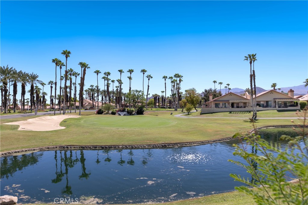 42002 Sand Dune Drive Palm Desert, CA 92211 - Photo 19 of 25 a view of a lake with houses