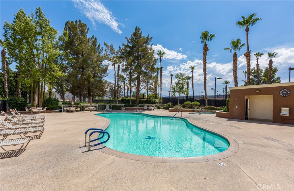 42002 Sand Dune Drive Palm Desert, CA 92211 - Photo 21 of 25 a view of a swimming pool with outdoor seating