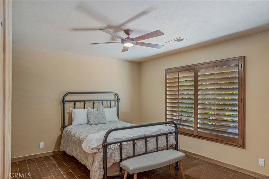 42002 Sand Dune Drive Palm Desert, CA 92211 - Photo 10 of 25 a bedroom with a bed and a window