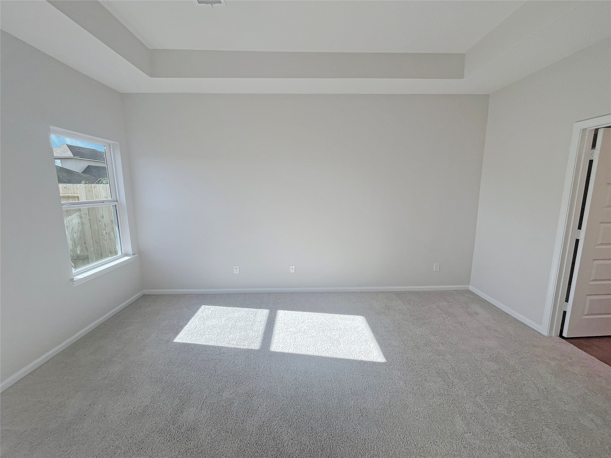 9781 Enclave Ridge Road Willis, TX 77318 - Photo 11 of 24 The Robin II- Primary Suite with Tray Ceiling.Sample image to be used for example only, colors, options and upgrades vary.