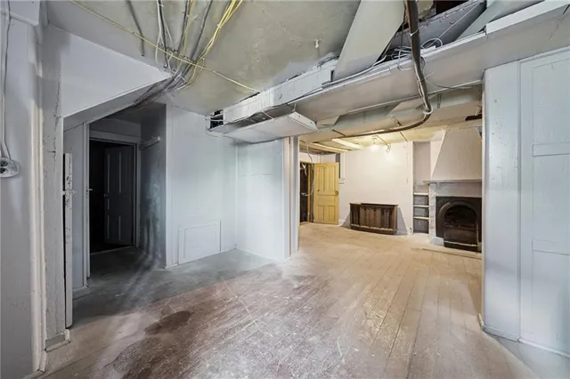 a view of a refrigerator and an empty room