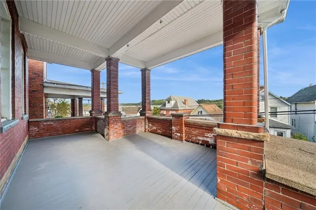 a view of living room with furniture and a large window