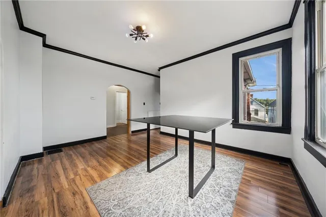 a view of workspace with wooden floor and furniture