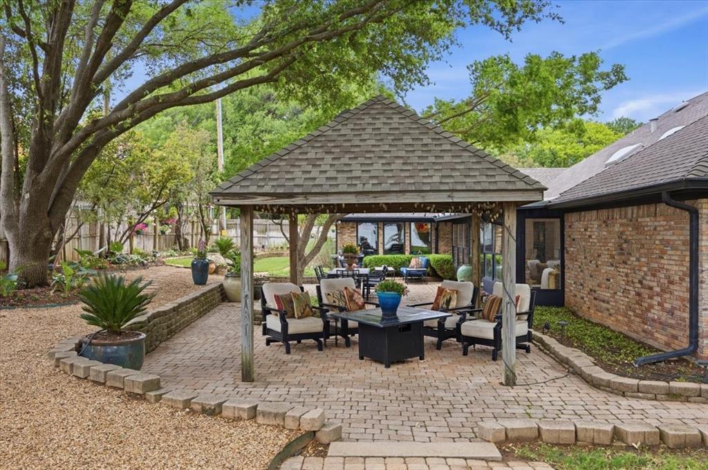 308 North Broadway Road Azle, TX 76020 - Photo 28 of 31 a view of a patio with table and chairs and potted plants