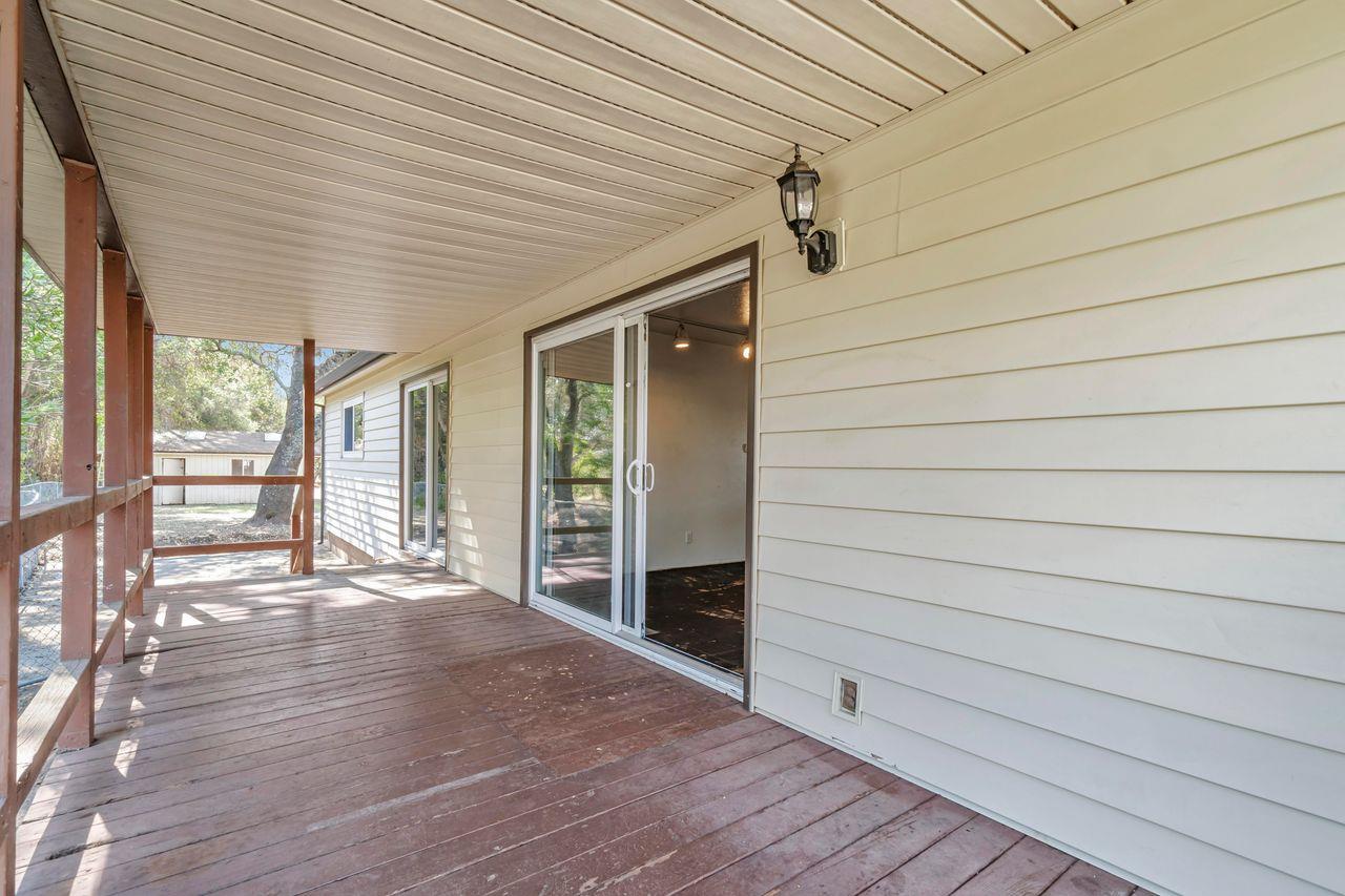 3331 Taylor Road Loomis, CA 95650 - Photo 48 of 98 a view of an empty room with wooden floor and a window
