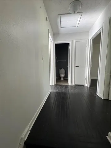 a view of room with window and hardwood floor