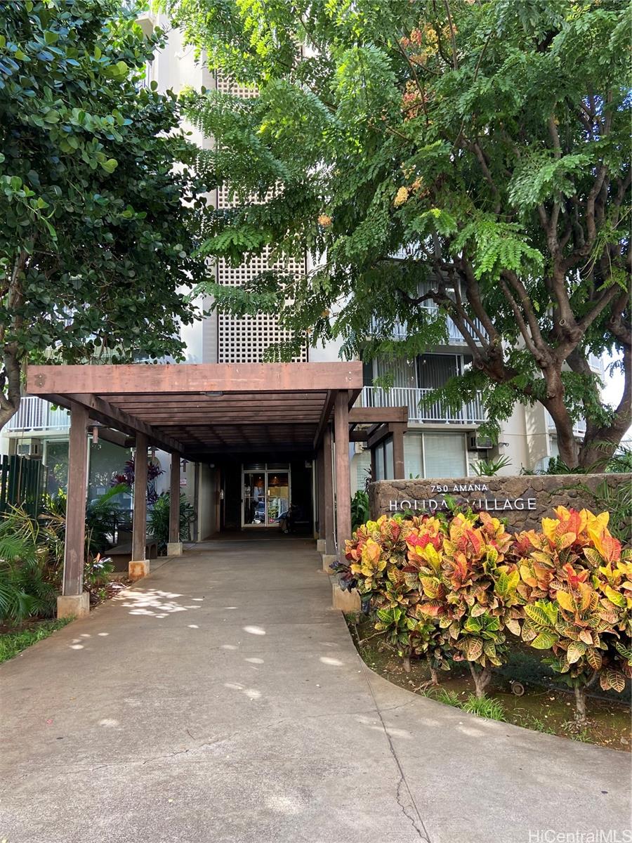 750 Amana Street, Unit 1602 Honolulu, HI 96814 - Photo 2 of 8 a front view of a house with garden
