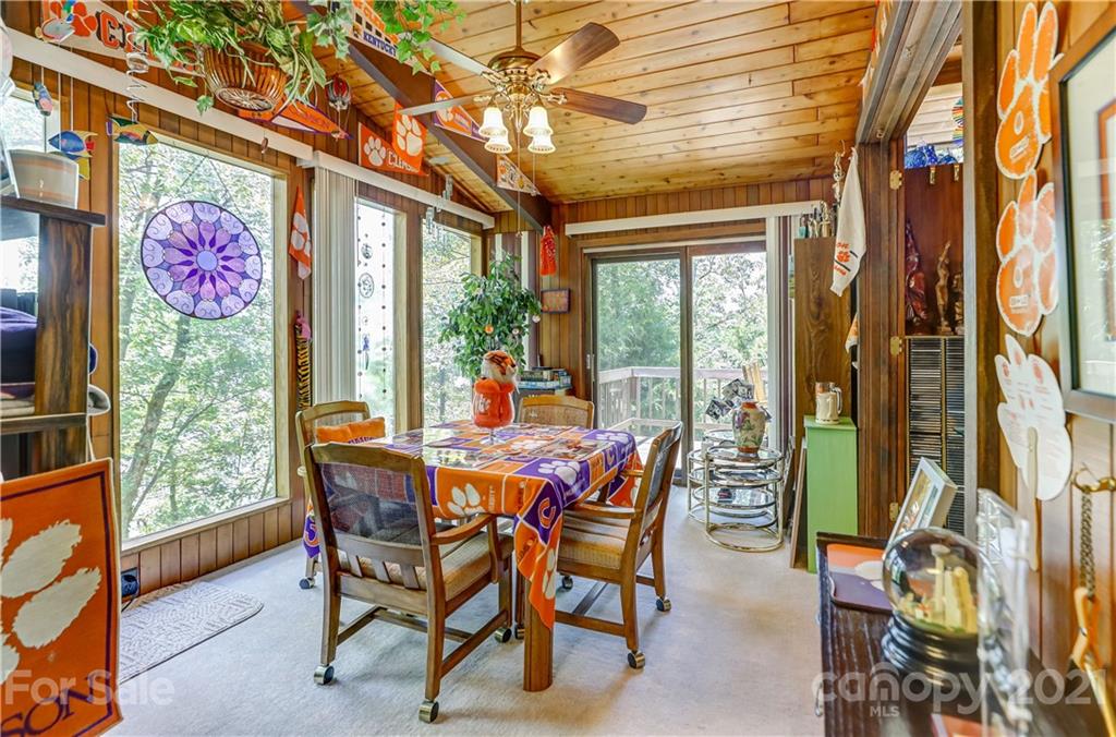 8017 Kiwi Point Tega Cay, SC 29708 - Photo 12 of 43 a dining room with furniture and a floor to ceiling window