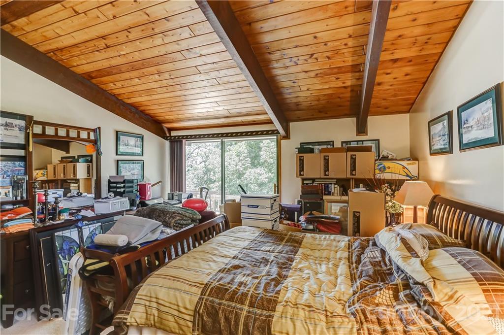 8017 Kiwi Point Tega Cay, SC 29708 - Photo 16 of 43 a bed room with a bed and a chair