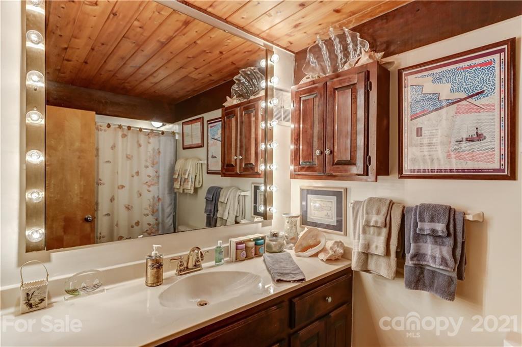 8017 Kiwi Point Tega Cay, SC 29708 - Photo 24 of 43 a bathroom with a sink double vanity and a mirror