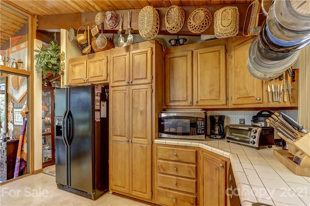 8017 Kiwi Point Tega Cay, SC 29708 - Photo 10 of 43 a kitchen with stainless steel appliances granite countertop a refrigerator and a stove top oven