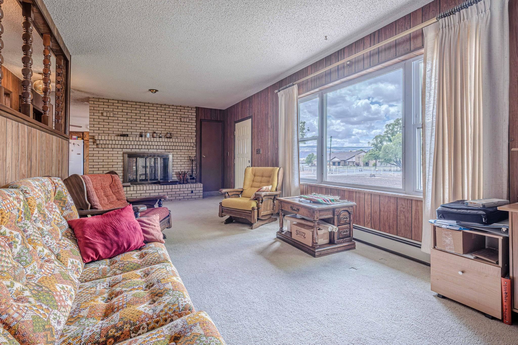 1176-17 17 1/2 Road Fruita, CO 81521 - Photo 16 of 42 a bedroom with furniture and large windows