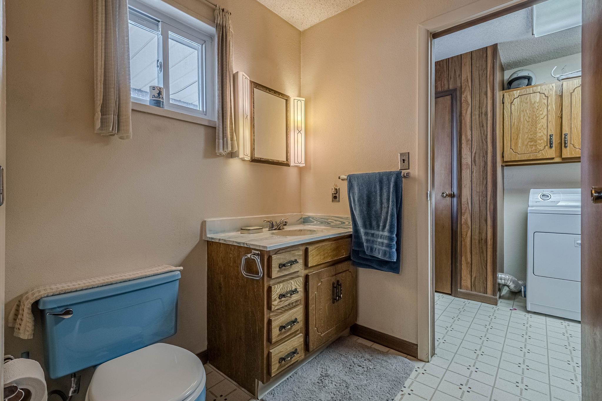 1176-17 17 1/2 Road Fruita, CO 81521 - Photo 18 of 42 a bathroom with a granite countertop toilet sink and mirror
