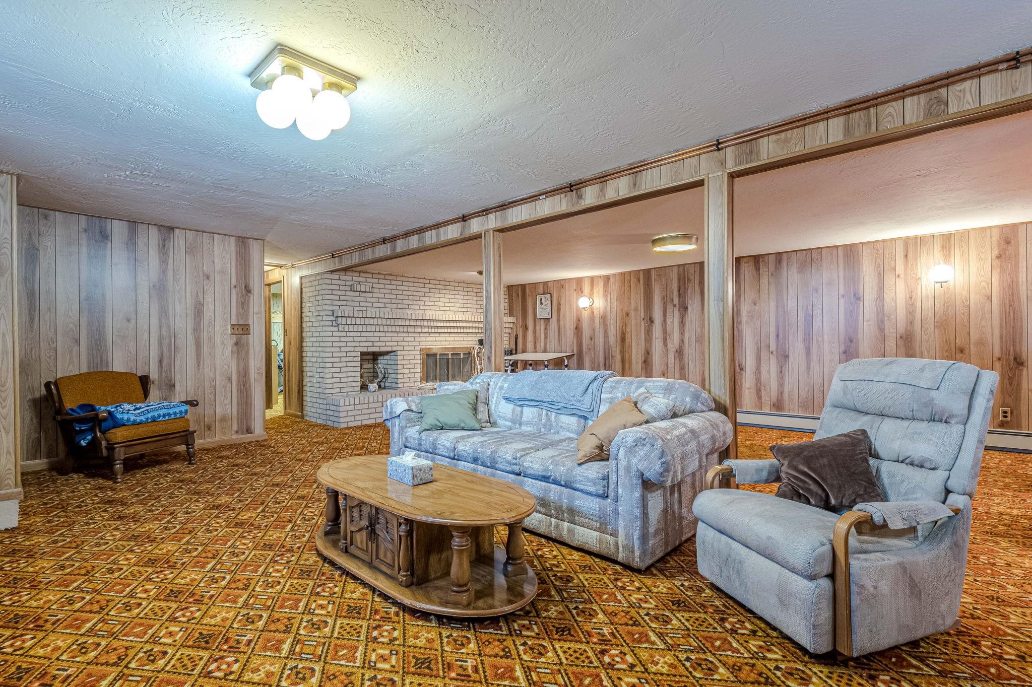 1176-17 17 1/2 Road Fruita, CO 81521 - Photo 35 of 42 a living room with furniture and a chandelier
