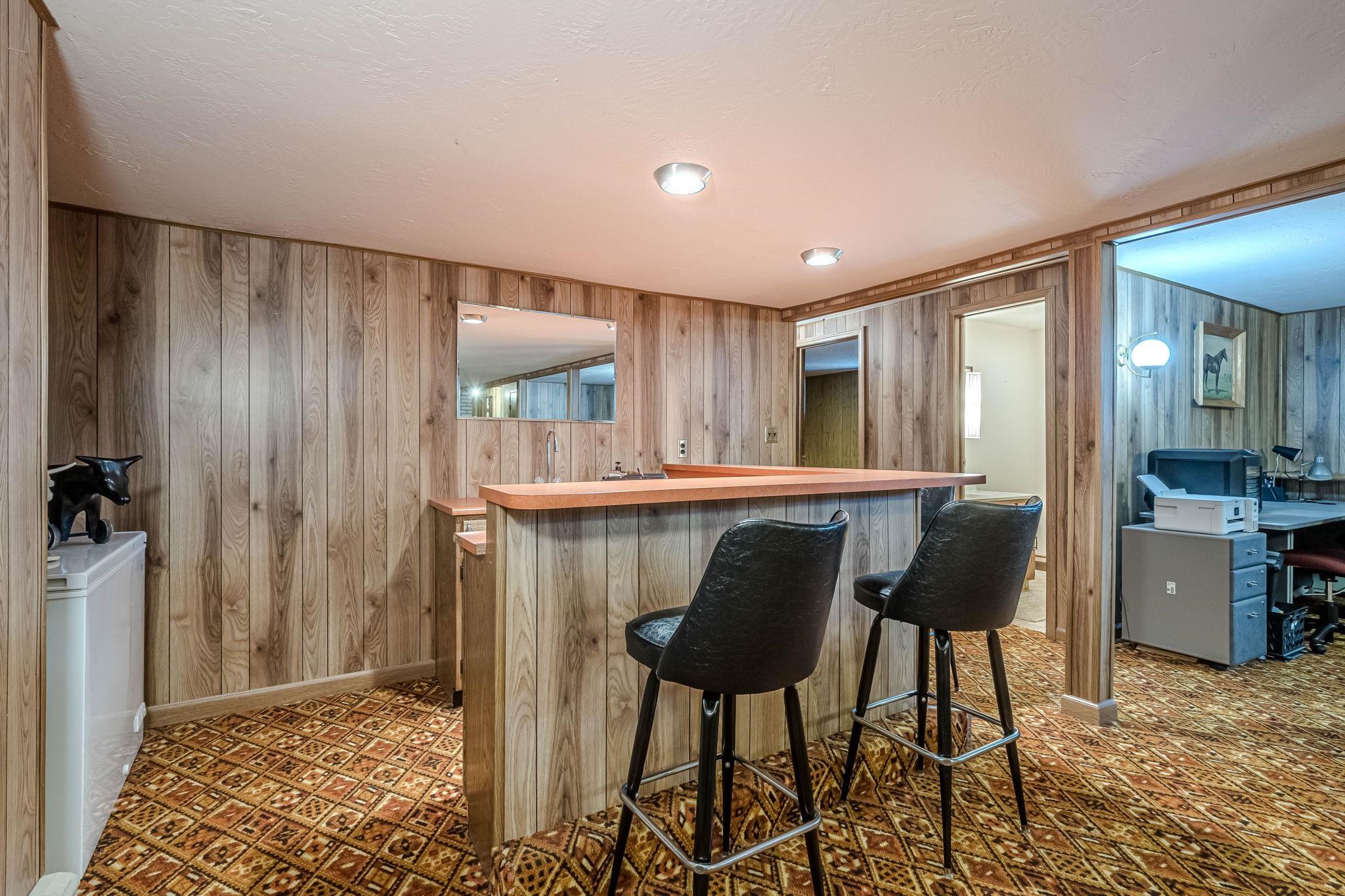 1176-17 17 1/2 Road Fruita, CO 81521 - Photo 37 of 42 a kitchen with stainless steel appliances kitchen island granite countertop furniture a refrigerator and a sink