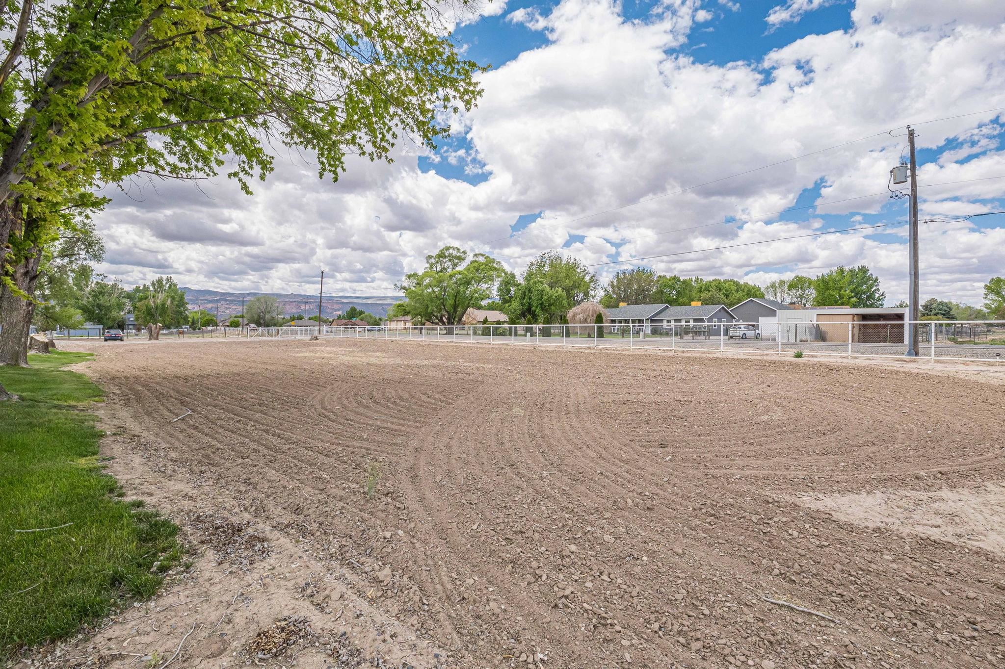 1176-17 17 1/2 Road Fruita, CO 81521 - Photo 4 of 42 a view of a road near a yard