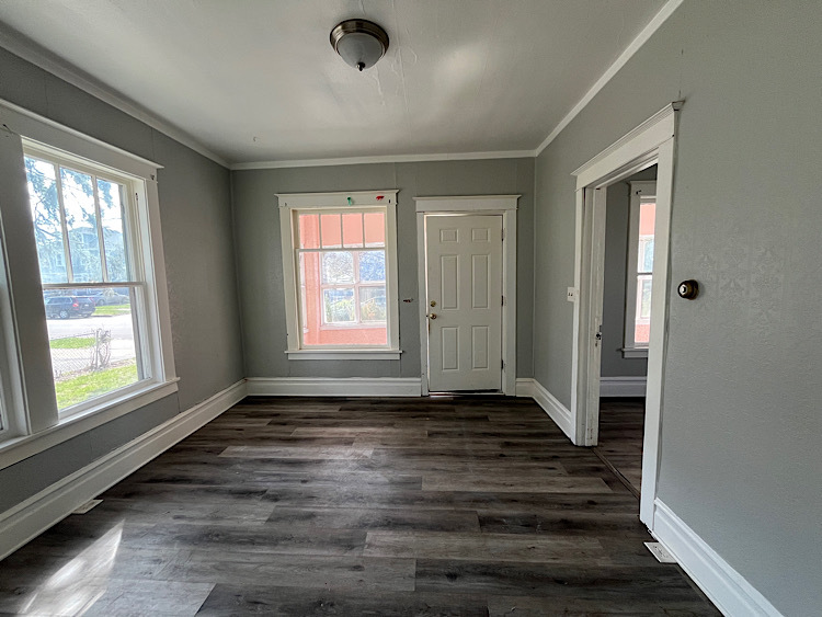 519 North View Street Aurora, IL 60506 - Photo 3 of 15 a view of an empty room with wooden floor and a window