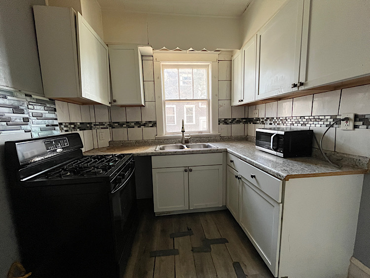 519 North View Street Aurora, IL 60506 - Photo 5 of 15 a kitchen with a sink stove top oven and cabinets