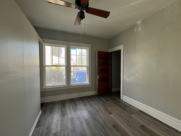 519 North View Street Aurora, IL 60506 - Photo 7 of 15 wooden floor in an empty room with a window