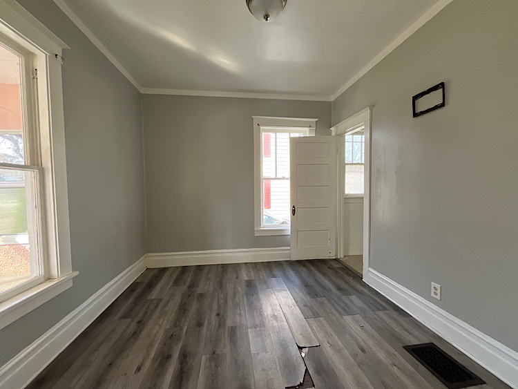 519 North View Street Aurora, IL 60506 - Photo 8 of 15 an empty room with wooden floor and windows