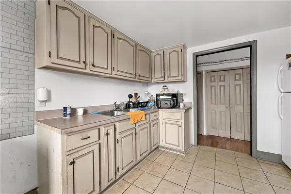 a kitchen with stainless steel appliances granite countertop a sink and dishwasher