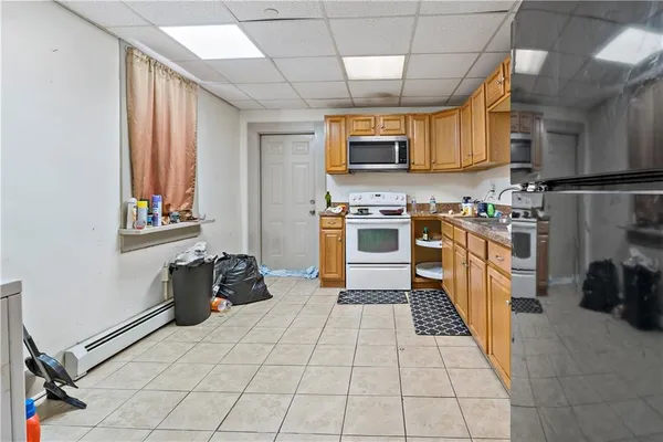 a kitchen with stainless steel appliances granite countertop a stove and a sink