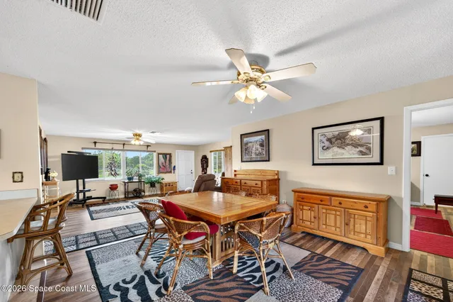 a workspace with furniture and a chandelier