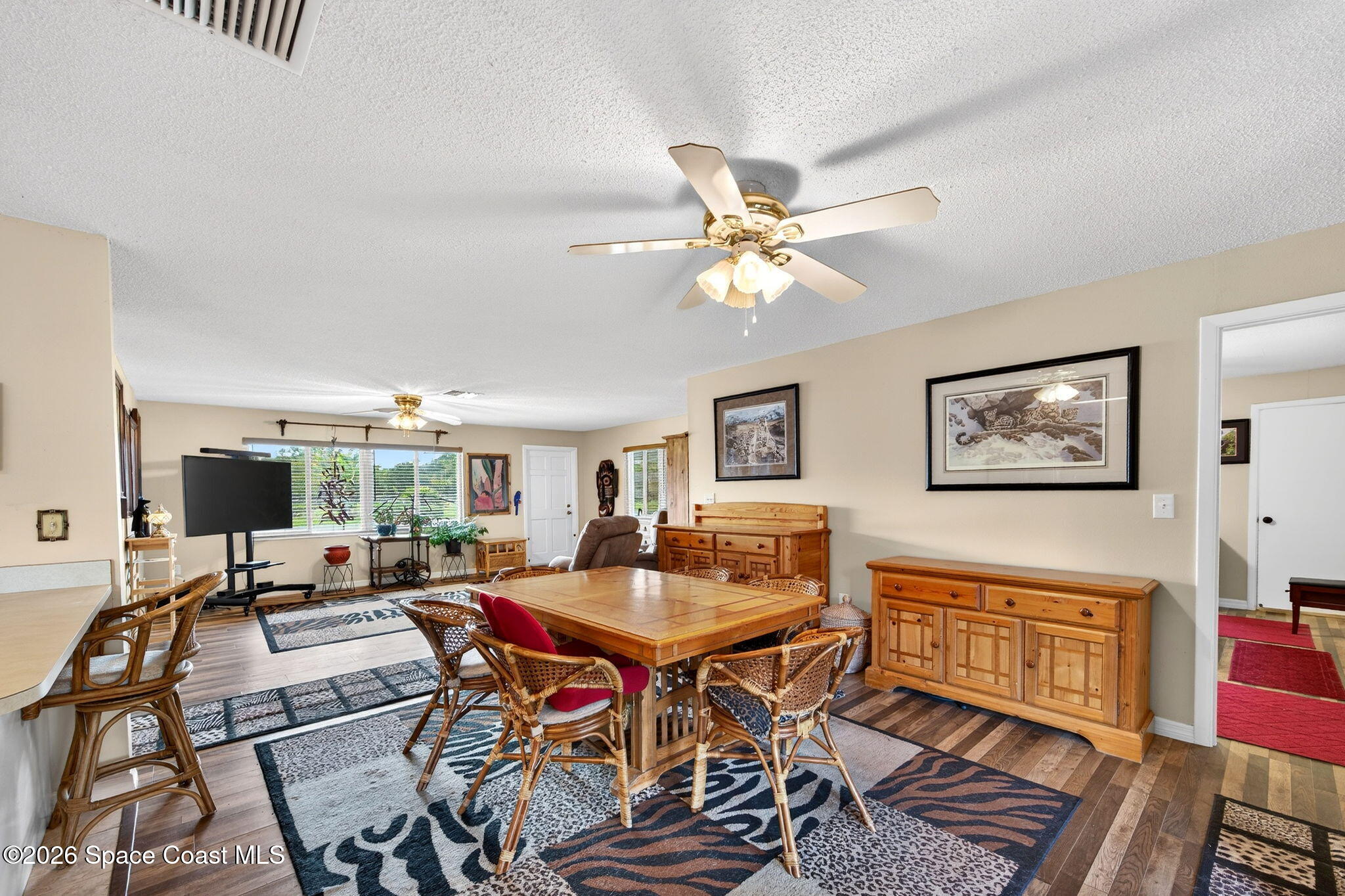 6033 Palm Street Mims, FL 32754 - Photo 12 of 44 a workspace with furniture and a chandelier