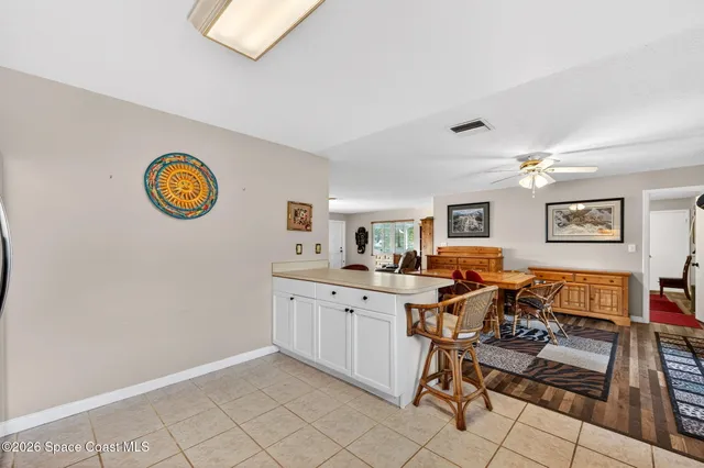 a view of a workspace with furniture