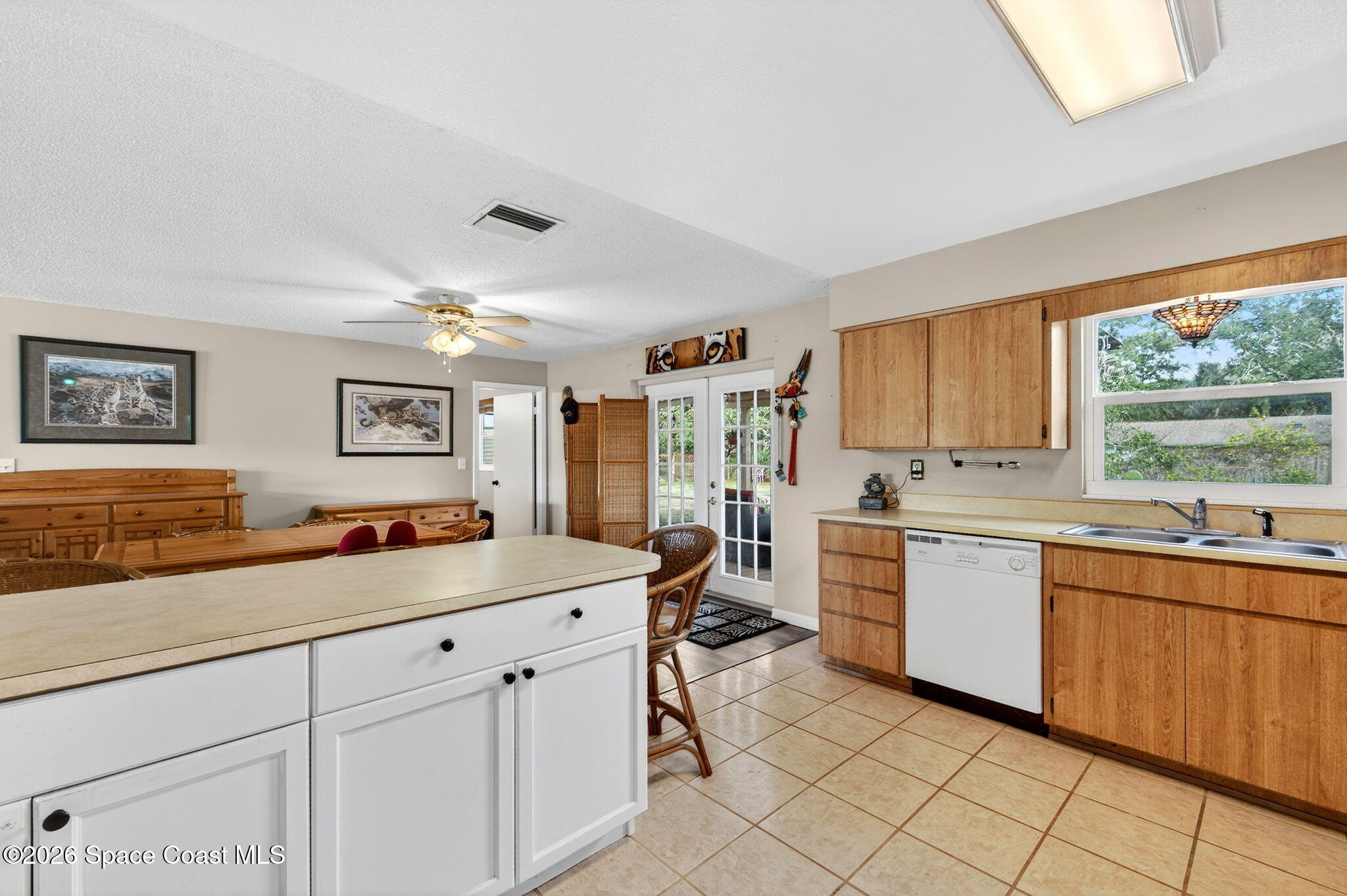 6033 Palm Street Mims, FL 32754 - Photo 17 of 44 a kitchen with sink and cabinets