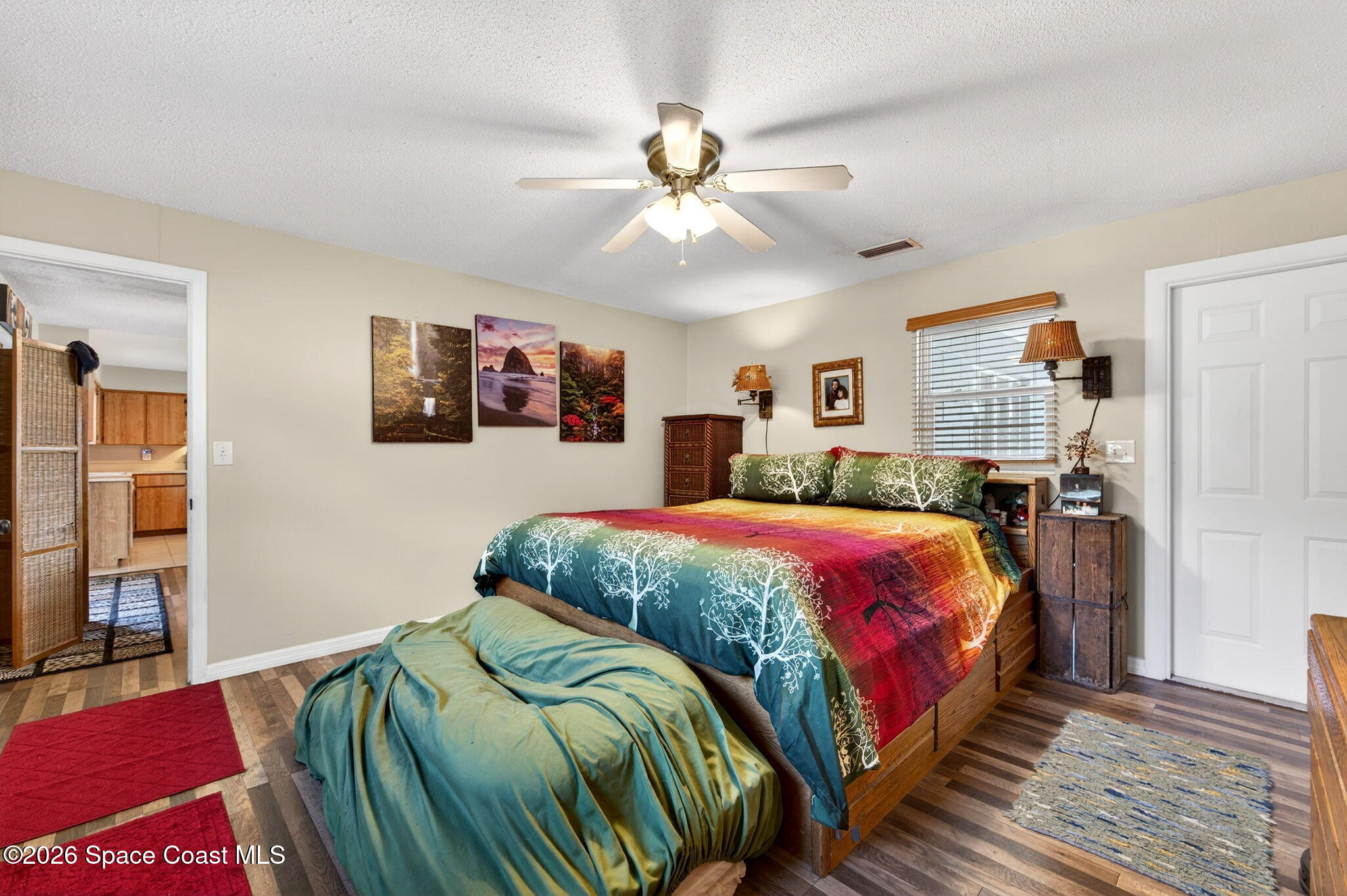 6033 Palm Street Mims, FL 32754 - Photo 20 of 44 a bedroom with a bed and window