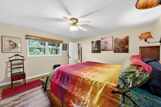 a bed room with a bed and a window