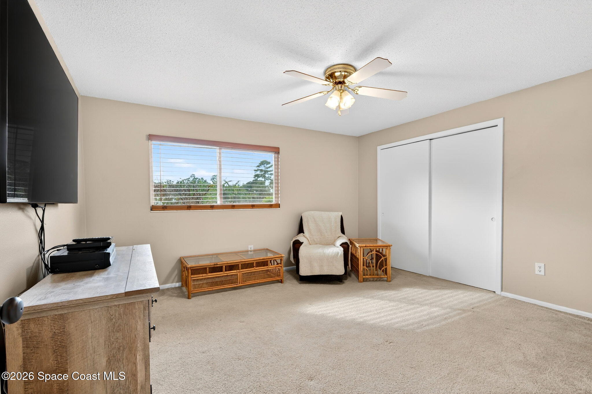 6033 Palm Street Mims, FL 32754 - Photo 23 of 44 a living room with furniture and a flat screen tv