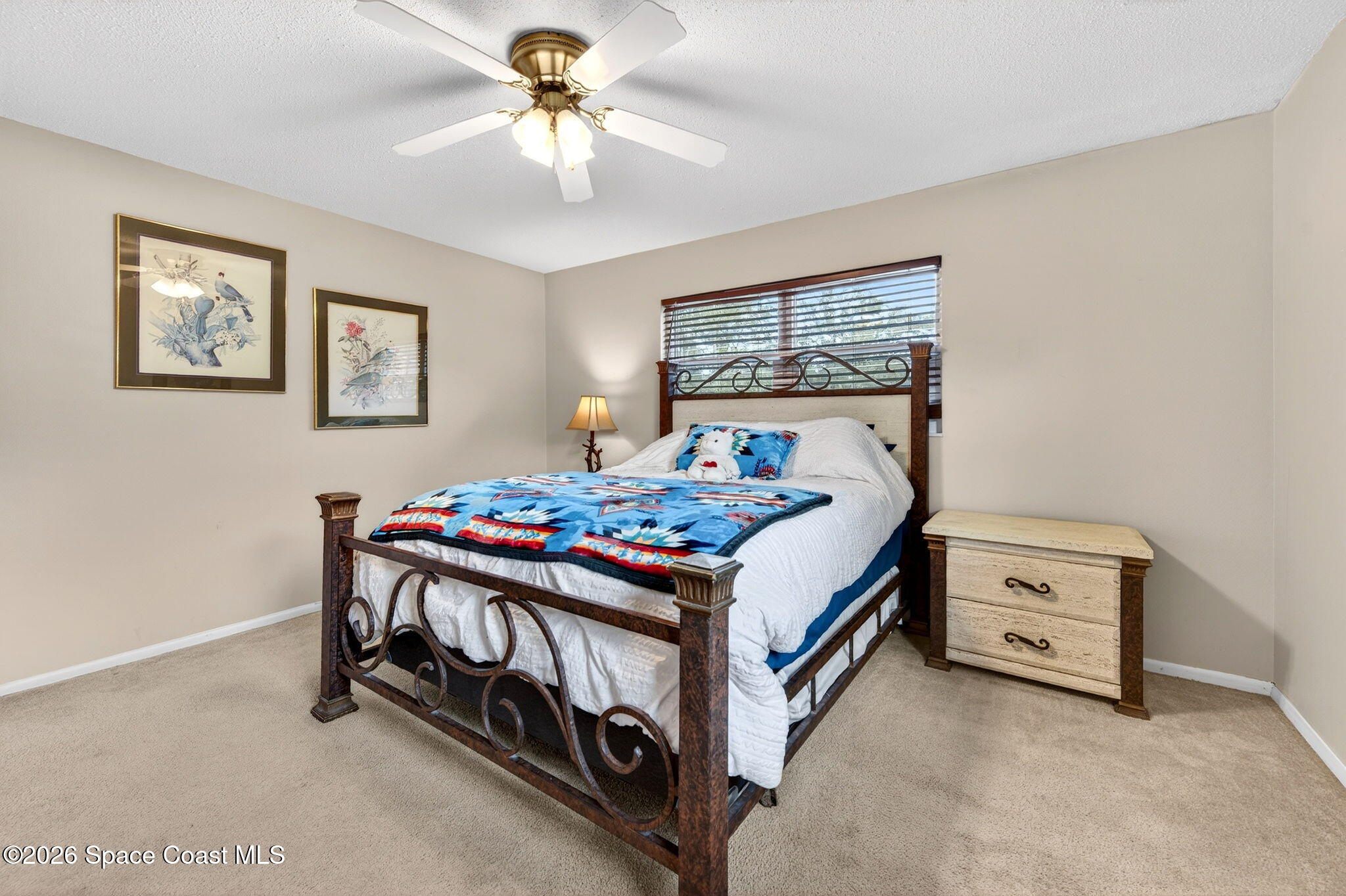 6033 Palm Street Mims, FL 32754 - Photo 26 of 44 a bedroom with a bed and a table in it