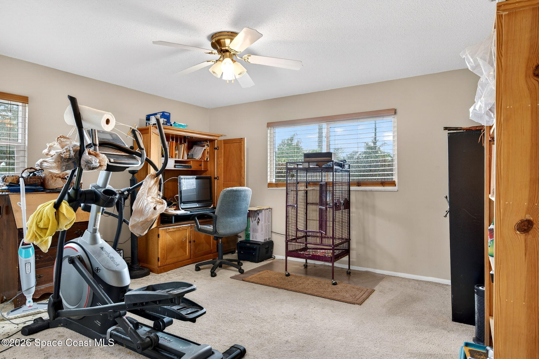 6033 Palm Street Mims, FL 32754 - Photo 28 of 44 a view of a workspace with furniture and a window