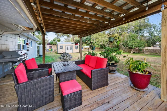 a outdoor living space with patio furniture and a potted plant
