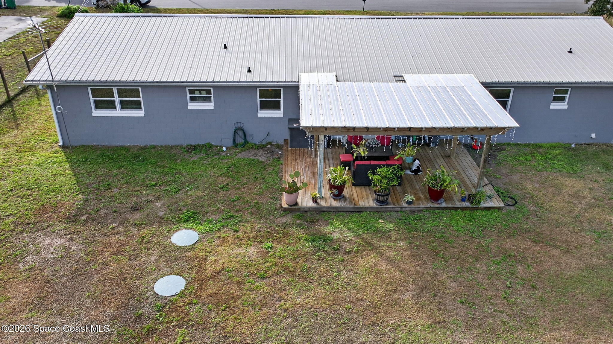 6033 Palm Street Mims, FL 32754 - Photo 3 of 44 an aerial view of a house with a yard
